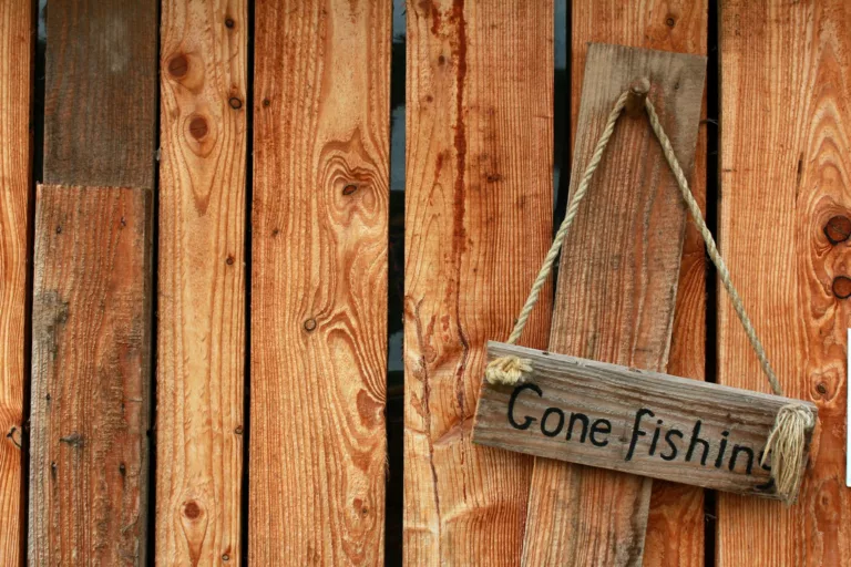 photo of a gone fishing sign