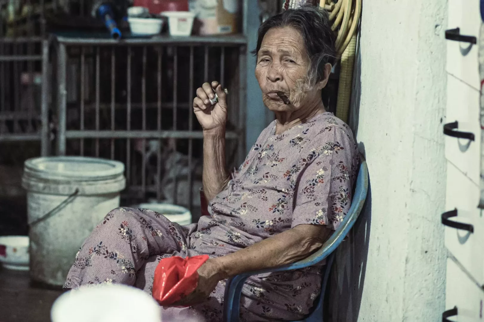 old woman smoking a cigar