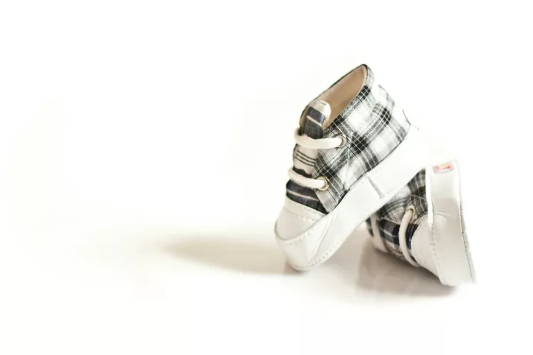 pair of toddler s white and gray shoes