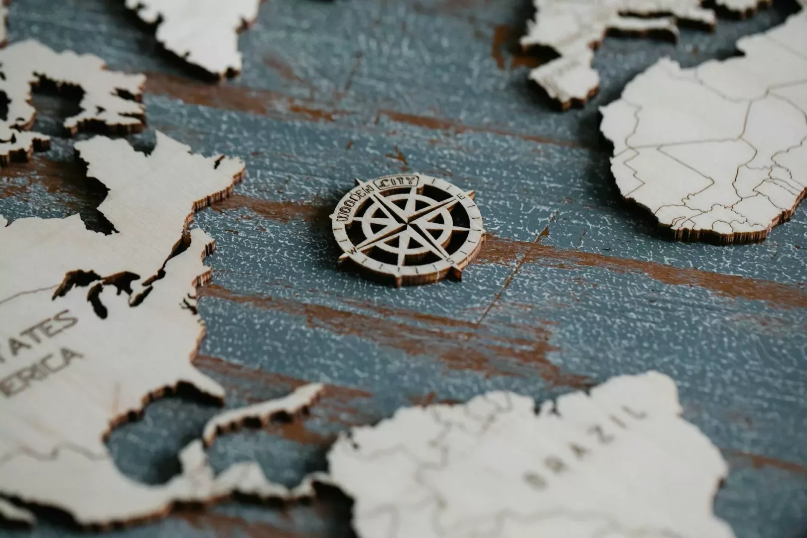 compass rose on a wooden world map