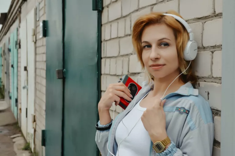 woman with headphones and portable cassette player