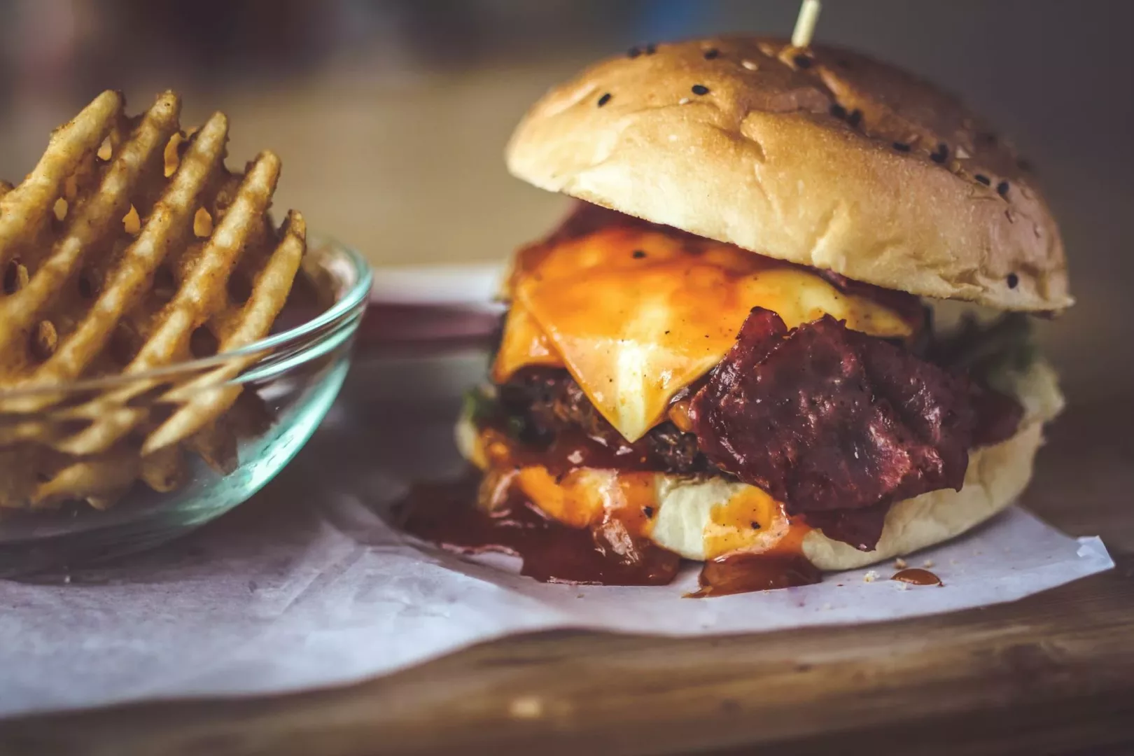 closeup photography of bun with cheese patty egg and bacon