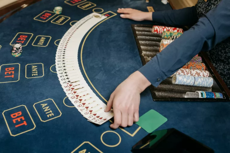 a dealer spreading the playing cards