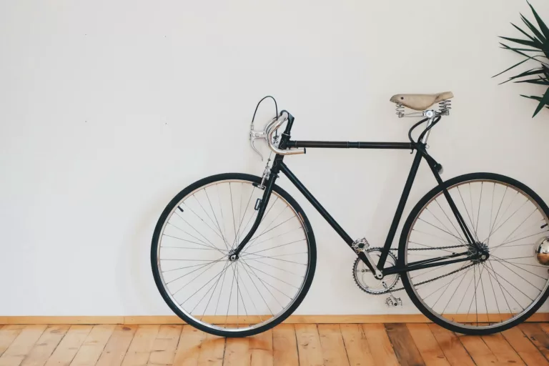 black fixed gear bike beside wall