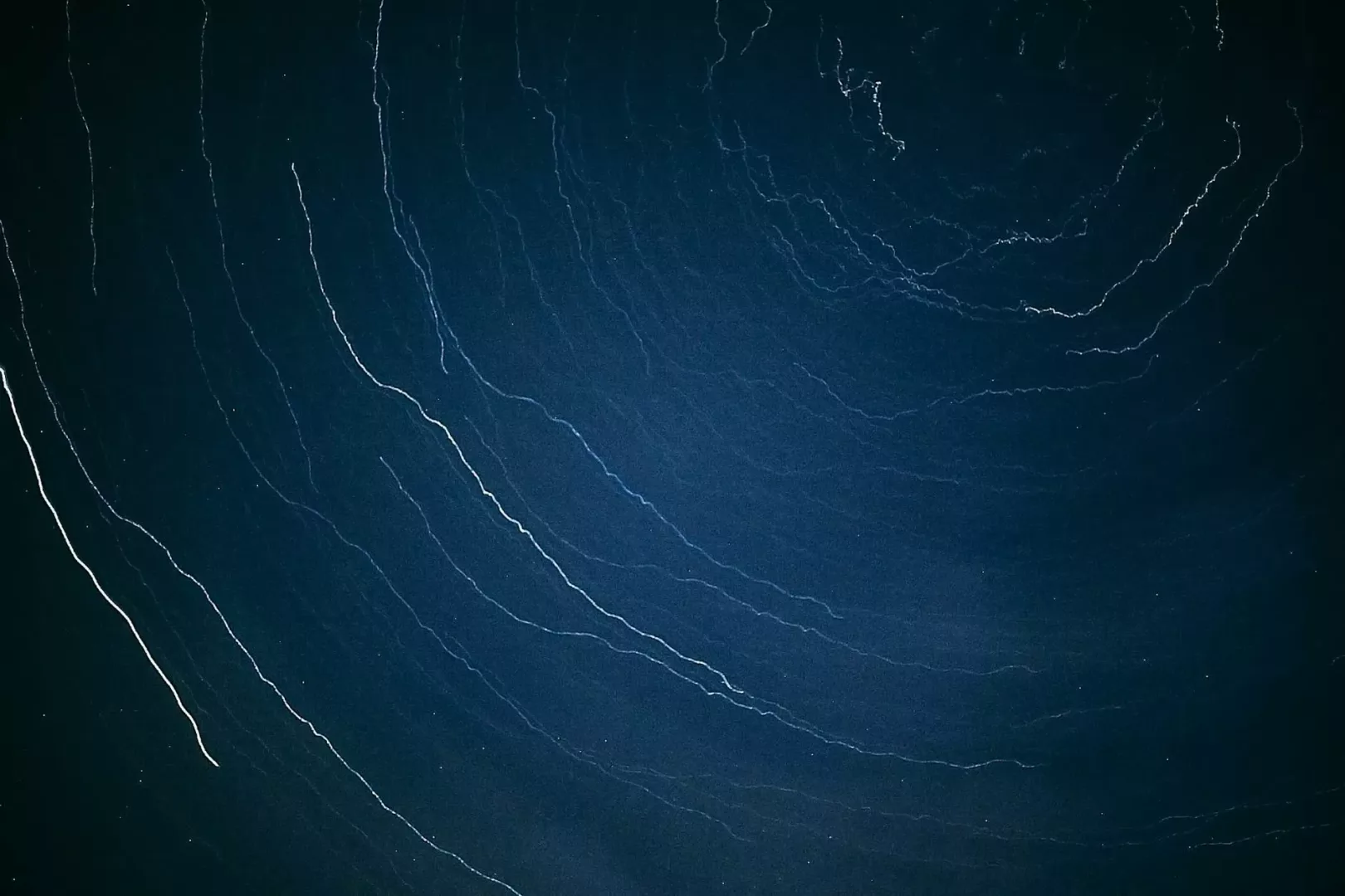 abstract background of thin threads on blue surface