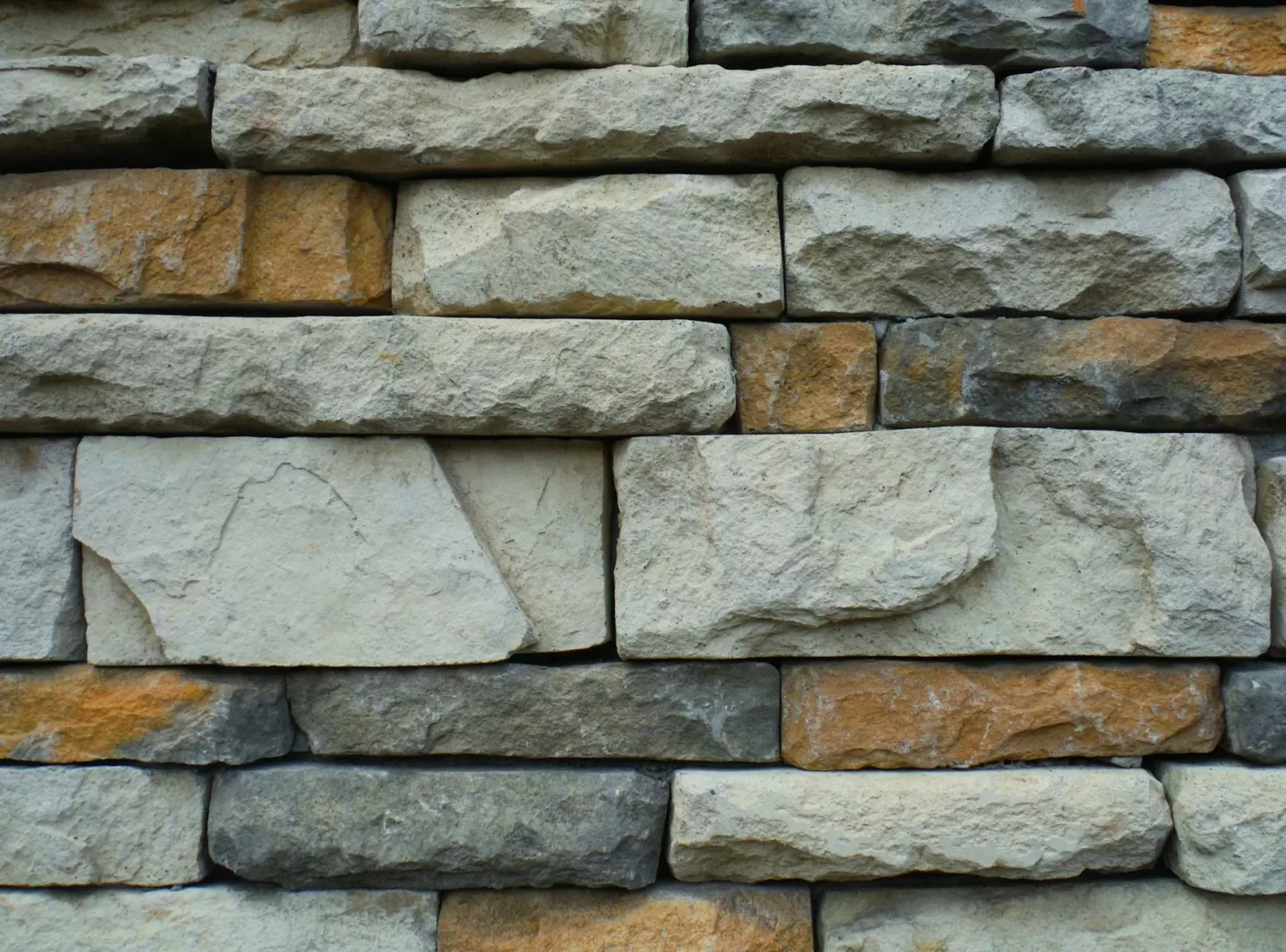 gray and brown concrete brick wall