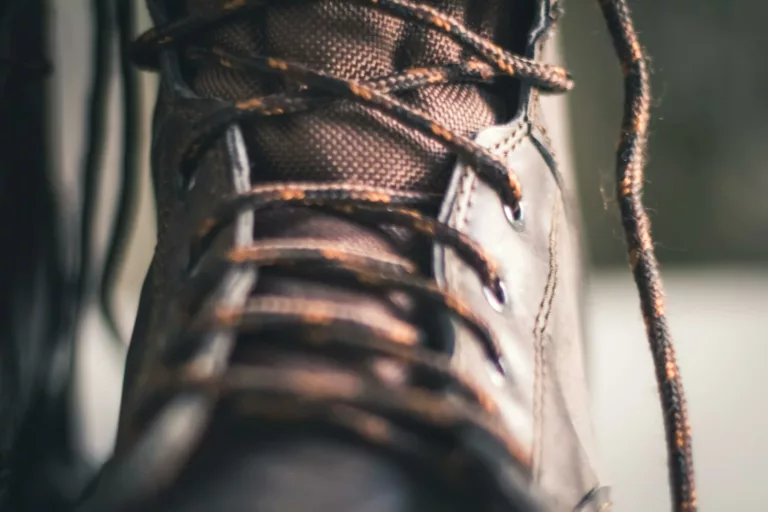 closeup photo of brown lace up boot