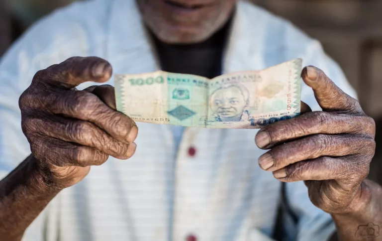 close up photo of person holding banknote