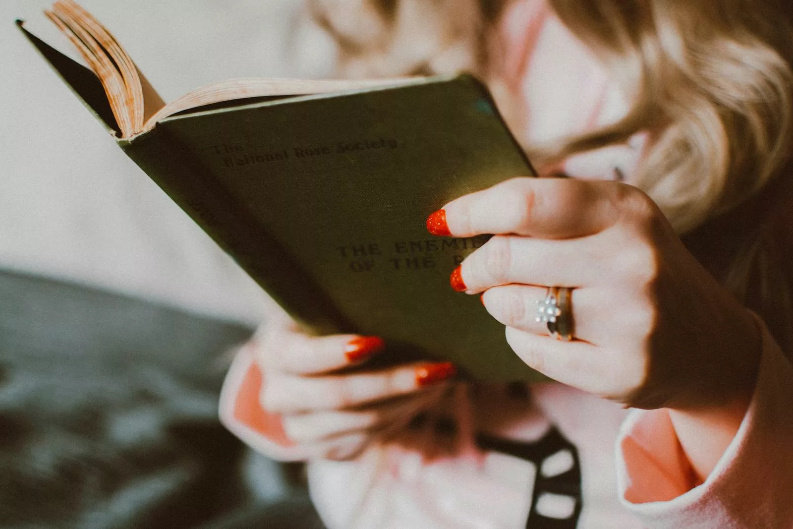 Woman Reading and Holding Book