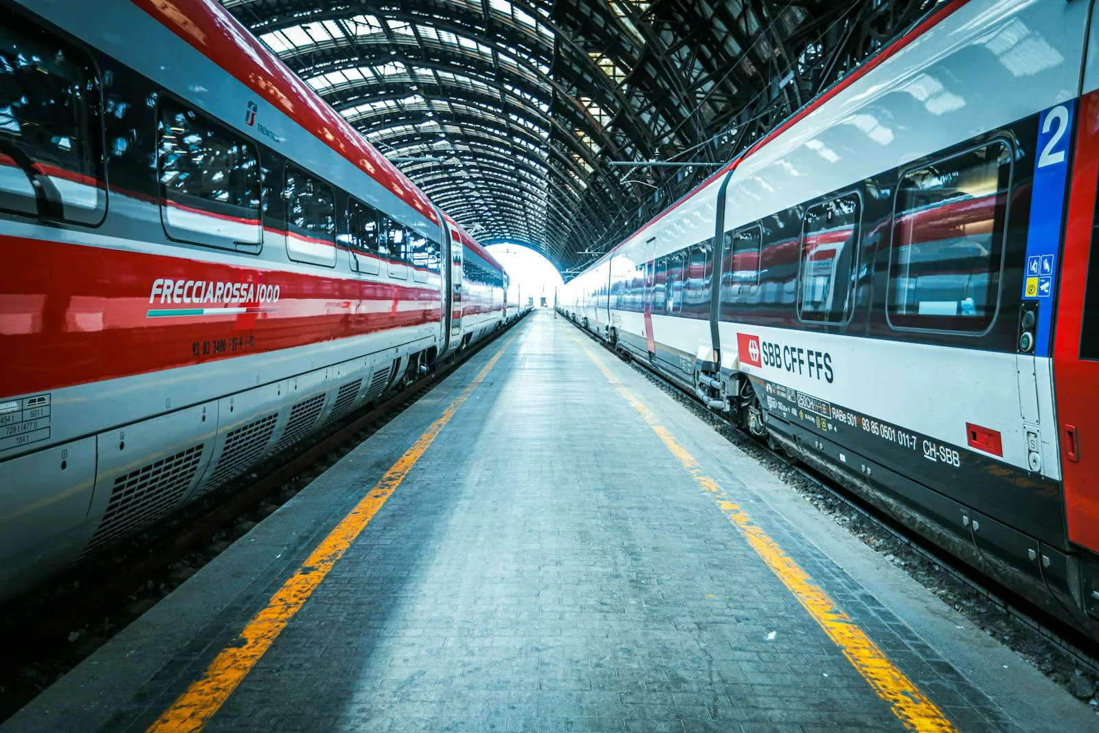 High-speed trains at Milano Centrale Station showcasing modern rail travel in Italy.